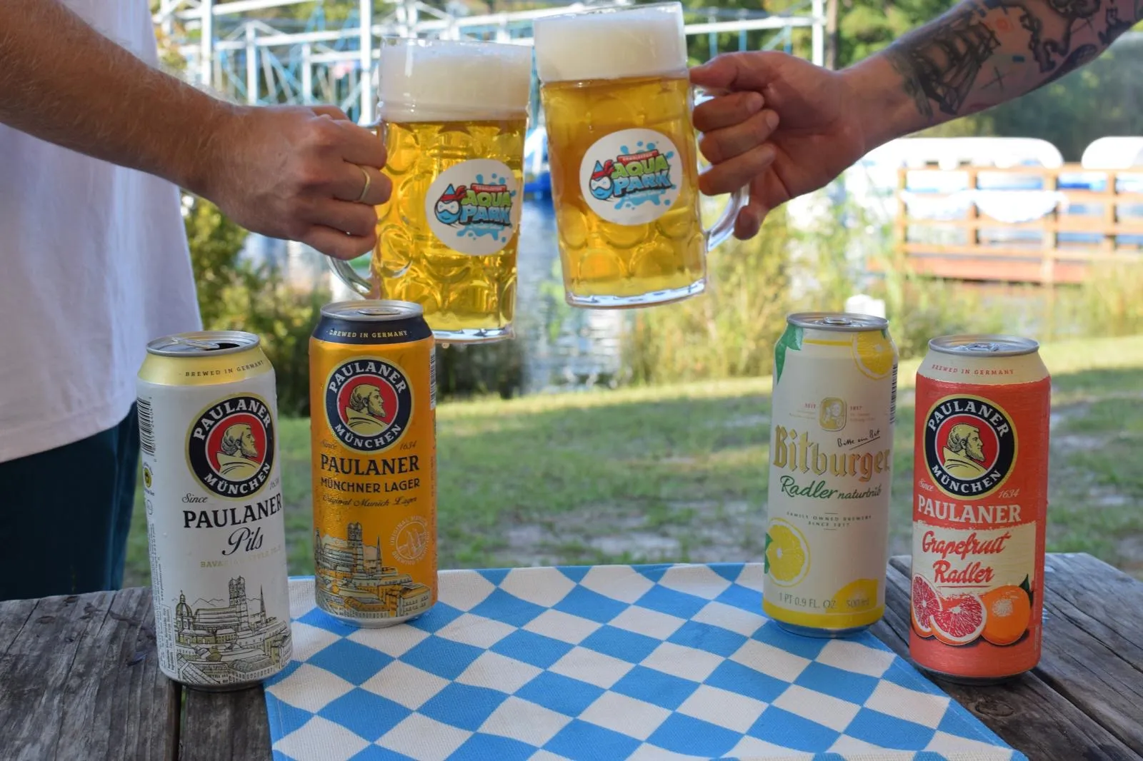 Friends toasting with one-liter steins at Oktoberfest on Trophy Lakes
