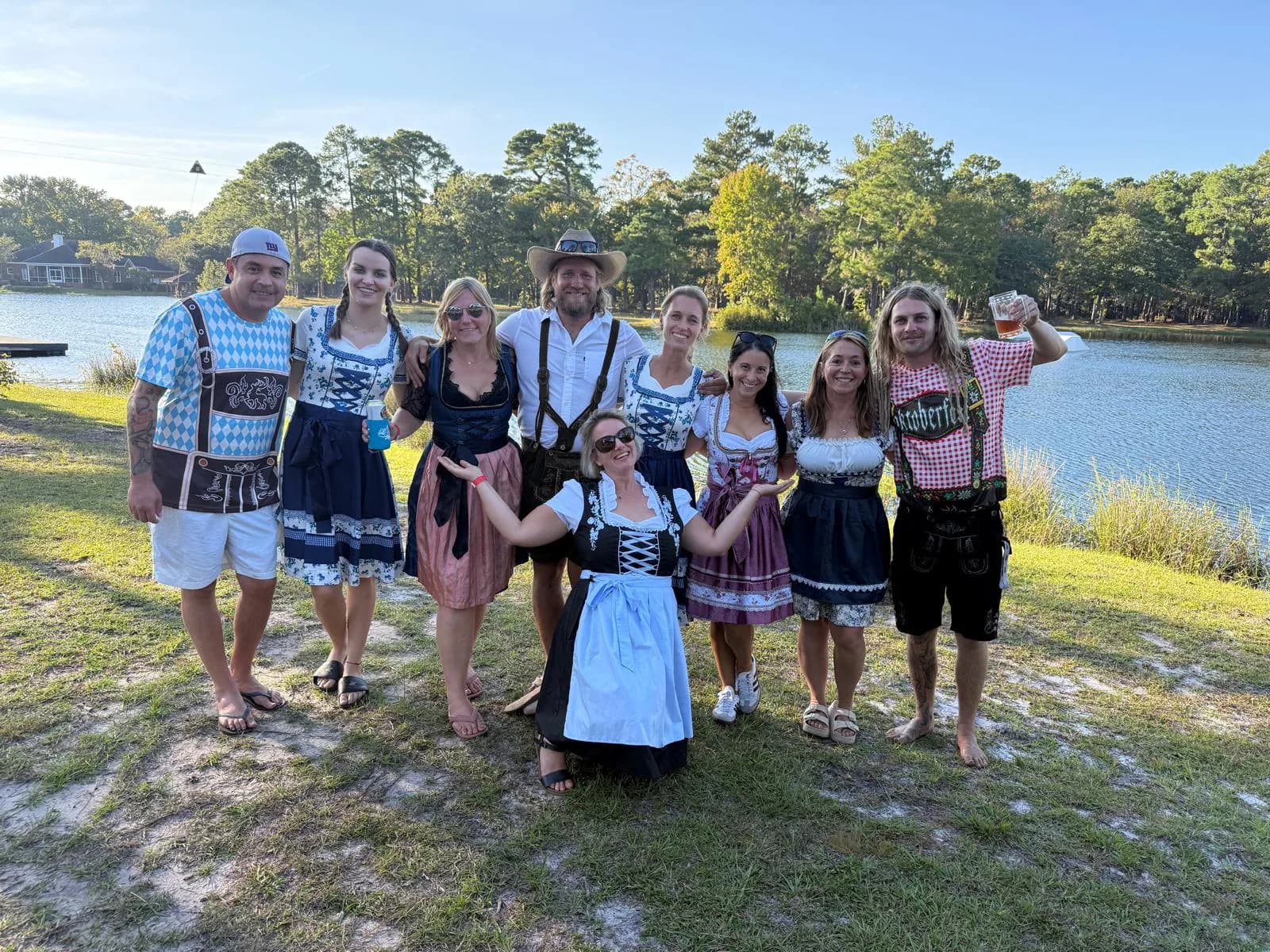 Friends in dirndl and lederhosen celebrating Oktoberfest on the lake at Charleston Aqua Park, Johns Island